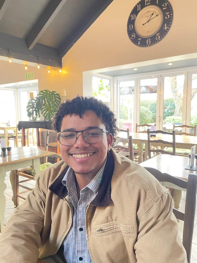 Ethan Classen smiling in a café